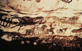 Rock painting of a leaping cow and a frieze of small horses