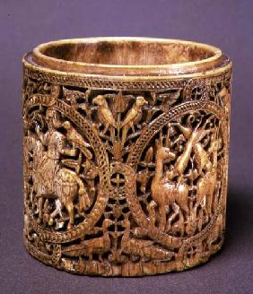 Cylindrical box (with missing lid) with carved decoration of hunting scenesSpanish 11th centu