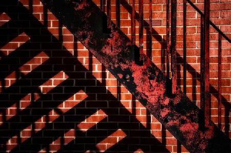 Fire escape on red wall 2020