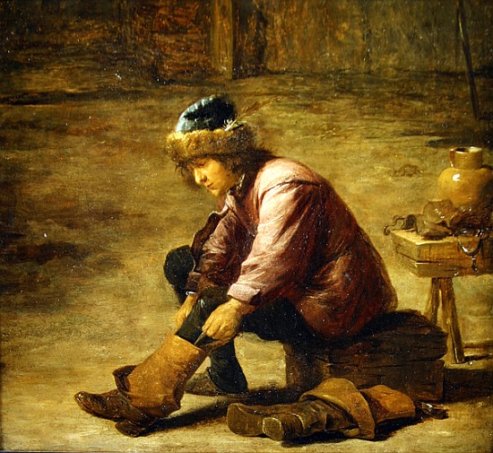 A young man pulling on a boot von David the Younger Teniers