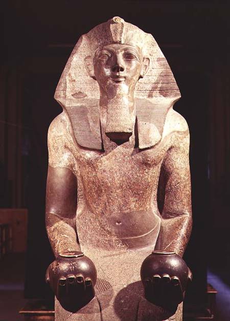 Statue of Queen Makare Hatshepsut (1503-1482 BC) holding two vases containing offerings of wine and von Egyptian