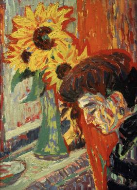 Frauenkopf vor Sonnenblumen