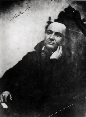 Charles Baudelaire (1821-67) seated in a Louis XIII armchair, 1855 (b/w photo) 