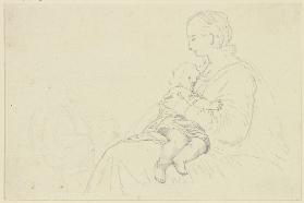 Sitzende Frau, dem auf ihrem Schoß liegenden Kind die Brust gebend
