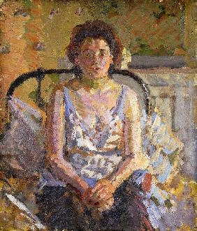 Frau auf einem Bett sitzend Um 1912-13