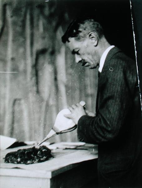 Mr Mace, Associate Curator of the Metropolitan Museum of Art, New York, treating one of the objects  von Harry Burton
