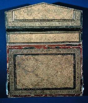 Outer face of a Koran case with gilded eslimi design of sura 56 in thulth
