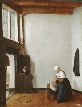Interior with a woman combing a little girl's hair 1662
