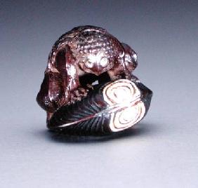 Netsuke depicting a kappa crouching on a clam shell 1860-80