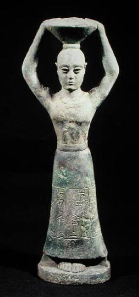 Statuette of an offering bearer with a votive inscription, from Uruk, Protoliterate Period 3rd millio