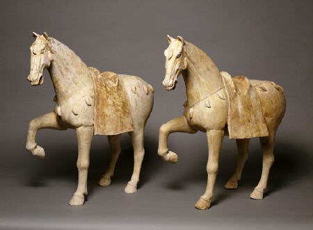 A Pair Of Buff Pottery Figures Of Prancing Caparisoned Horses von 
