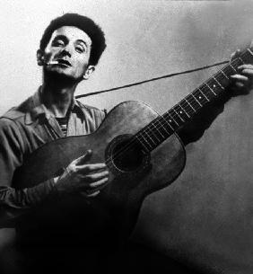 Musician Woody Guthrie considered as the father of folk music c. 1940
