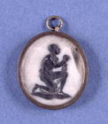Wedgwood Jasper Medallion mounted in an oval pendant, depicting a slave and the inscription 'Am I No 14th
