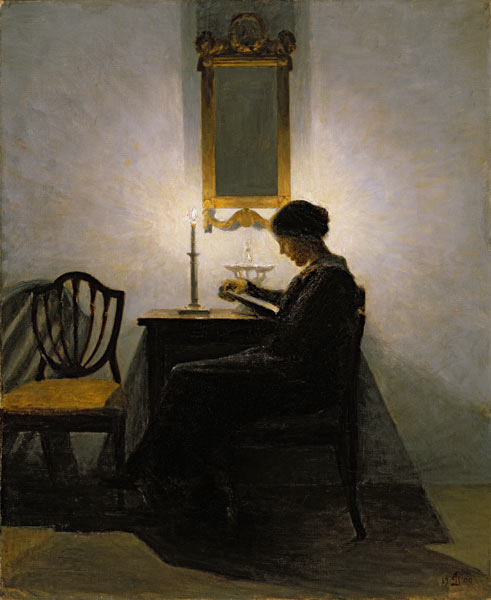 Woman reading by candlelight von Peter Vilhelm Ilsted