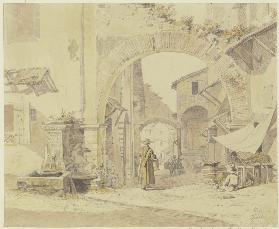 Straße in einem italienischen Städtchen (Tivoli), links ein Brunnen, rechts eine Gemüsehändlerin