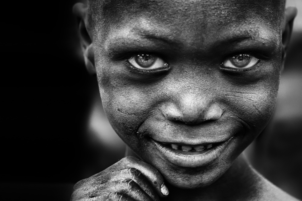 Kinderlächeln,Bergmannshände – Benin von Sergio Pandolfini